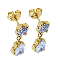 Hängande guldörhängen med glittriga stenar