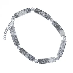 Silverarmband med stavar krusbandsmönster